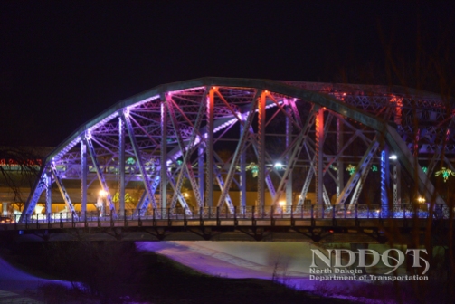 The Sorlie Bridge that spans the Red River between Grand Forks and East Grand Forks, MN has had LED lighting added to it. The lights are controlled by a computerized device which is placed inside the pumphouse next to the river near the bridge. The color of the lights can be changed easily and several preprogramed color schemes are coordinated with holidays and special events.